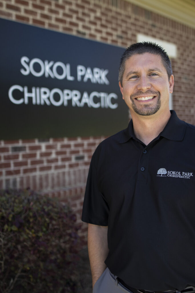male black-haired chiropractor