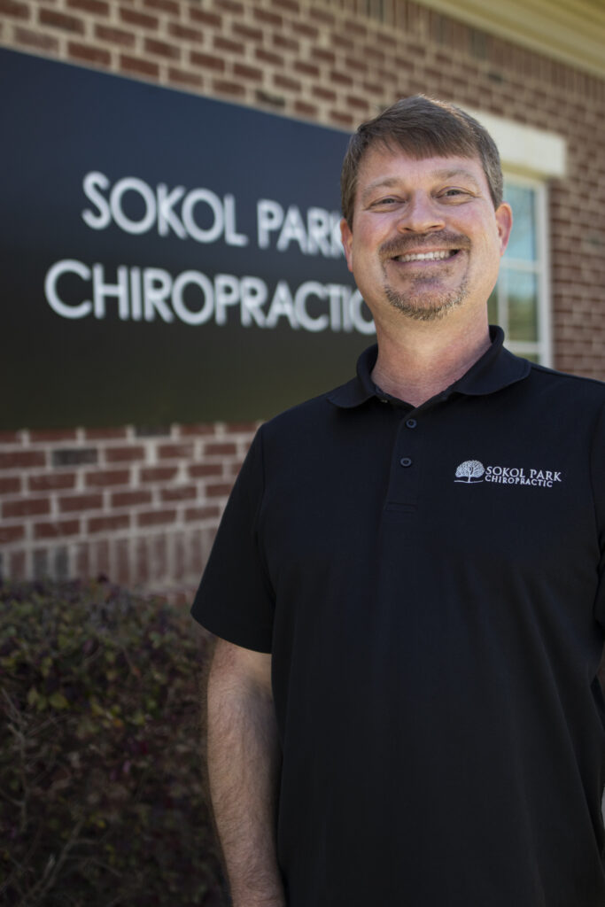 brown hair male chiropractor
